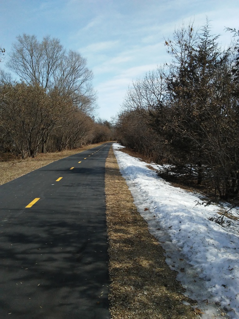 paved bike trail in early spring